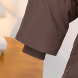 Pikowana kurtka damska z paskiem w talii – ciepła kurtka zimowa w stylu eleganckim