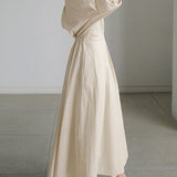 Elegancka sukienka koszulowa maxi z paskiem w talii