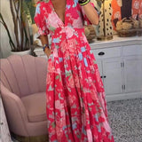 Zwiewna sukienka maxi w kwiaty z dekoltem V – elegancka i kobieca