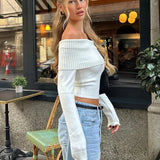 Sweter damski z odkrytymi ramionami – elegancki model hiszpanka