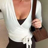 Bluzka kopertowa z długim rękawem i wiązaniem