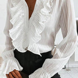 Elegancka bluzka damska z falbanami i dekoltem V