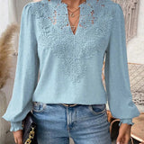 Elegancka bluzka damska z haftem i bufiastymi rękawami