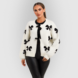 Sweter damski z motywem kokardek – miękki kardigan zapinany na guziki