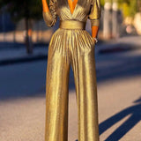 Elegancki kombinezon z połyskiem i kopertowym dekoltem